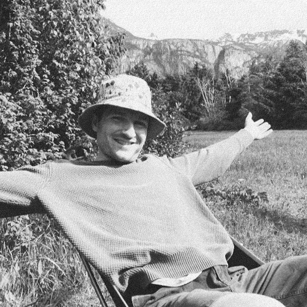 Photo of Adrian sitting in Nature
